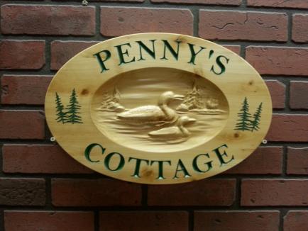 wooden cottage sign 