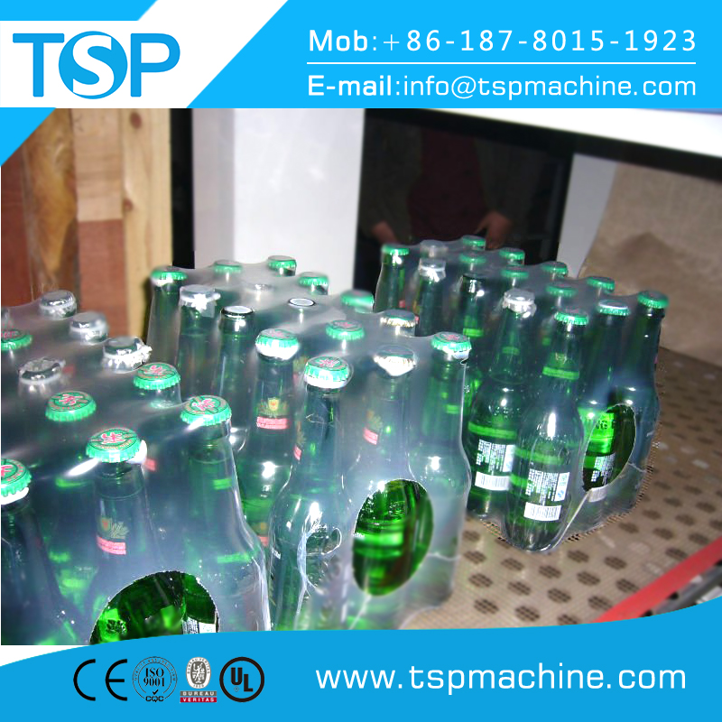 Automatic plastic shrink wrap packaging for beverage product